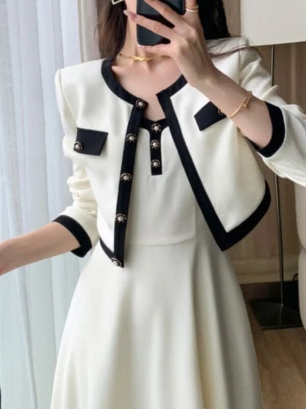 A woman in white dress taking a selfie