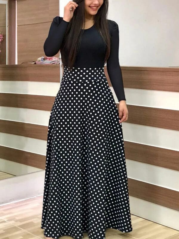 A woman in black and white polka dot dress.