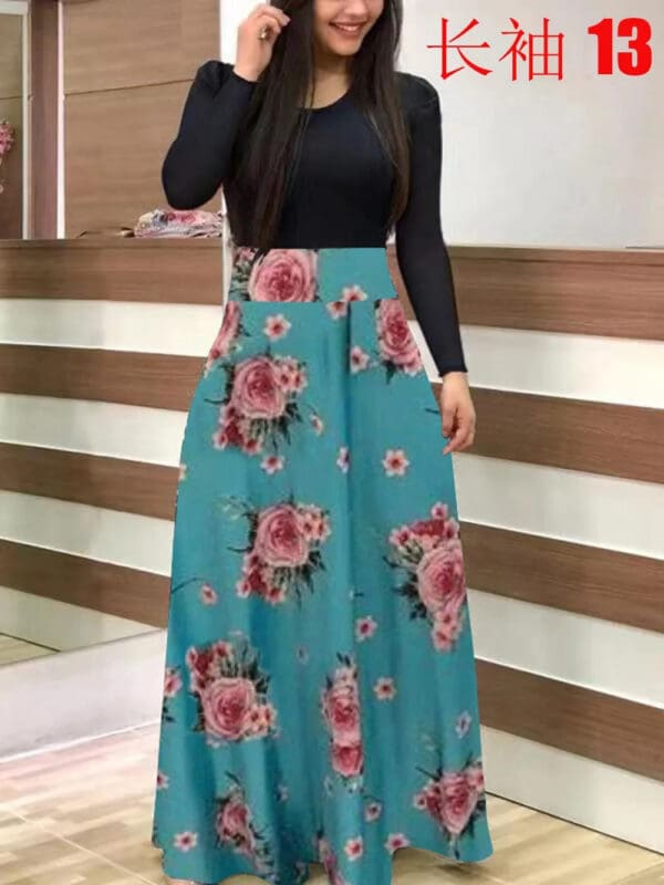 A woman standing in front of a mirror wearing a long blue floral skirt.