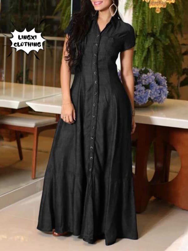 A woman in black dress standing on top of a table.