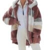 A woman in white pants and a pink jacket