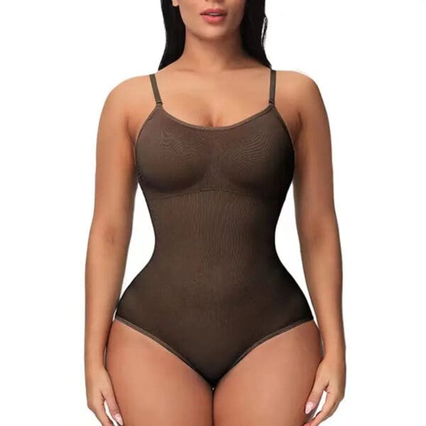 A woman in a brown bodysuit is standing up