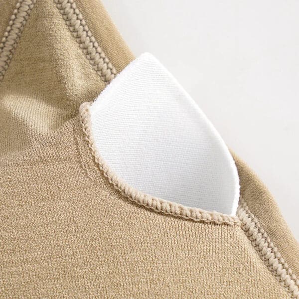 A close up of the corner of a tan bag