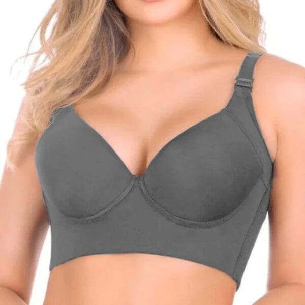 A woman wearing a gray bra with no padding.