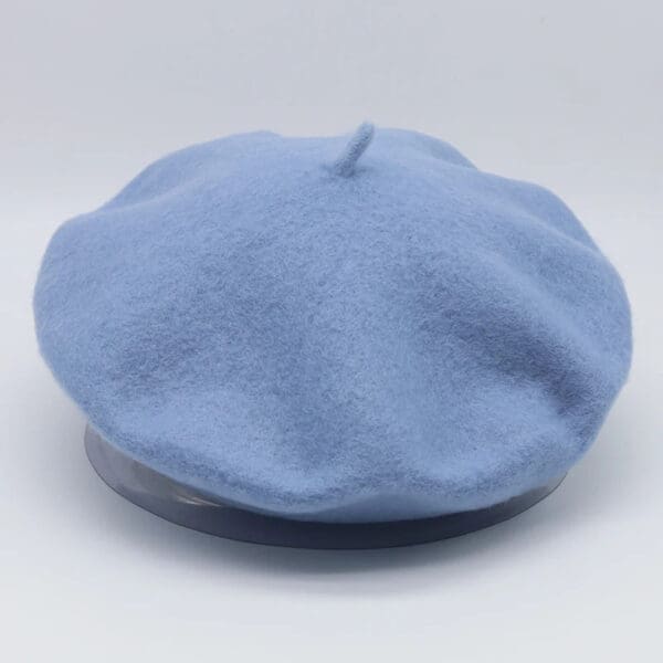 A blue hat is on the ground