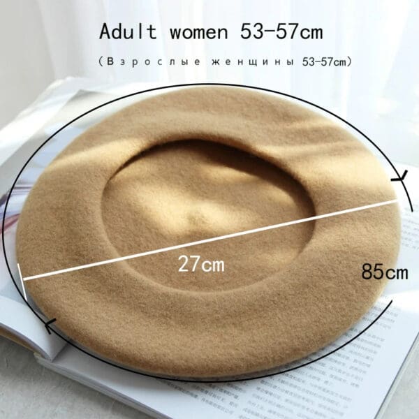 A woman is wearing a beret and has the size of her head measured.