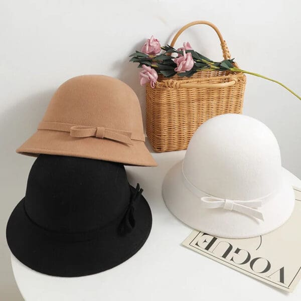 A table with three different hats on it