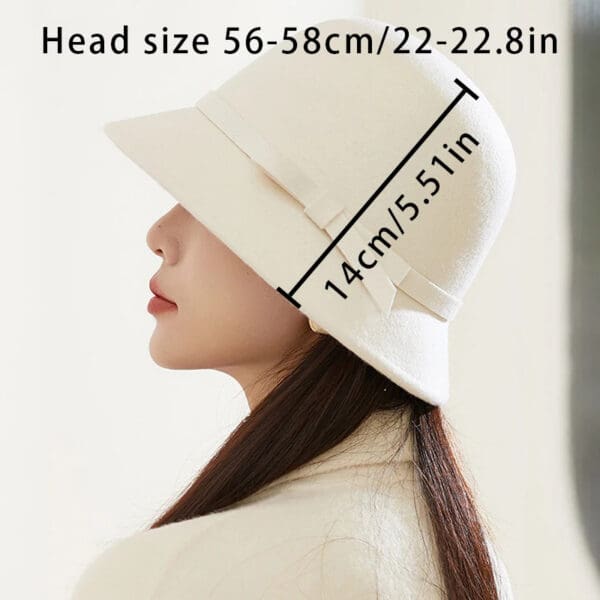 A woman wearing a white hat with the measurements of her head.